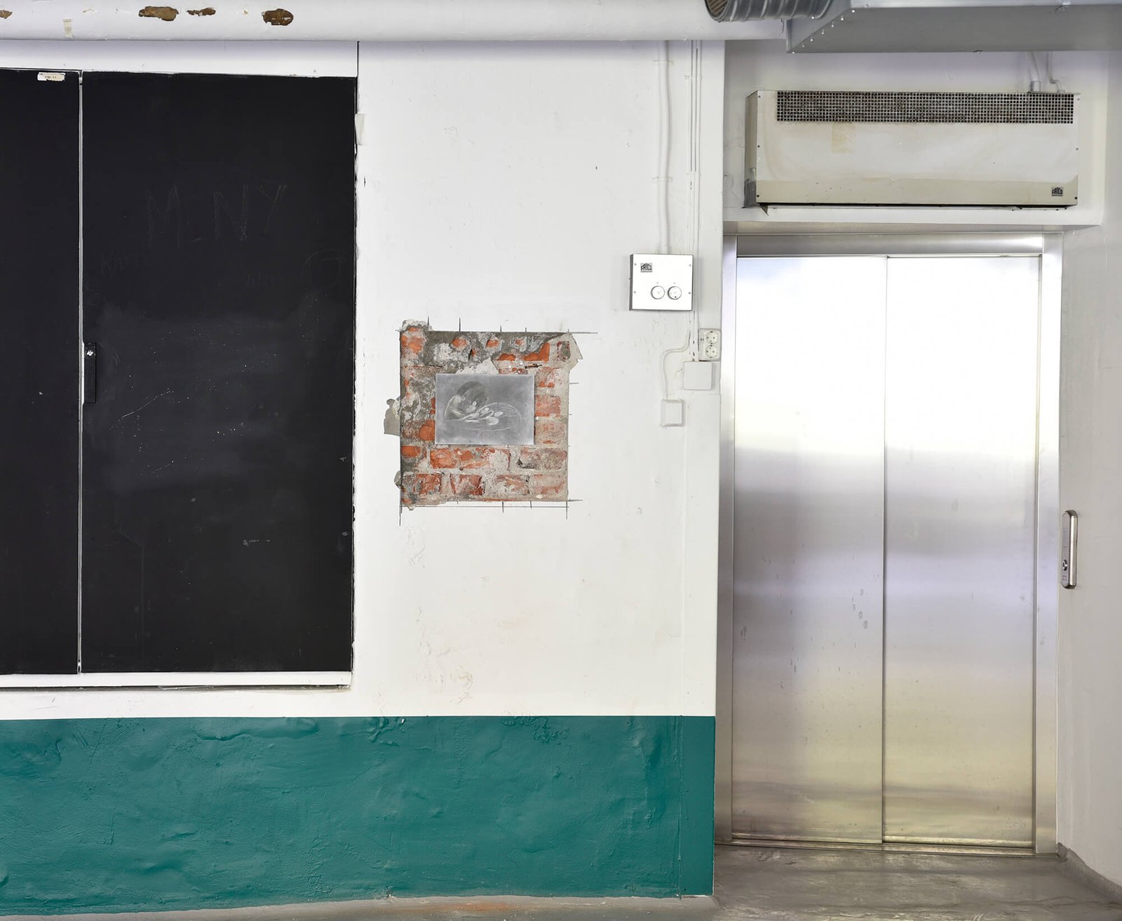 Installation view of drawing on brick wall
